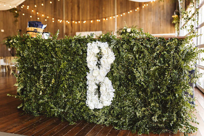 Flower monogram decor at barn wedding at Spring Creek Ranch in Tennessee