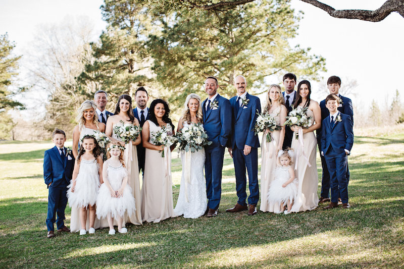 Wedding party at barn wedding venue Spring Creek Ranch in Tennessee