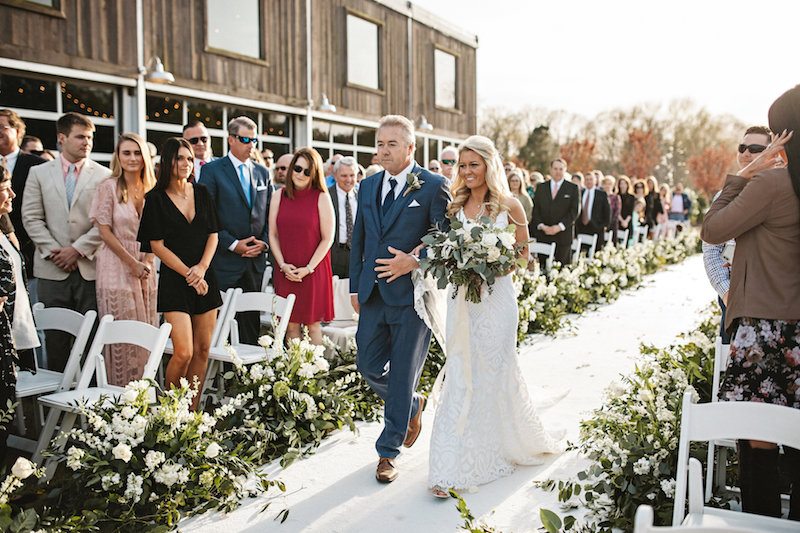 Rustic outdoor wedding ceremony at barn wedding venue Spring Creek Ranch in Tennessee