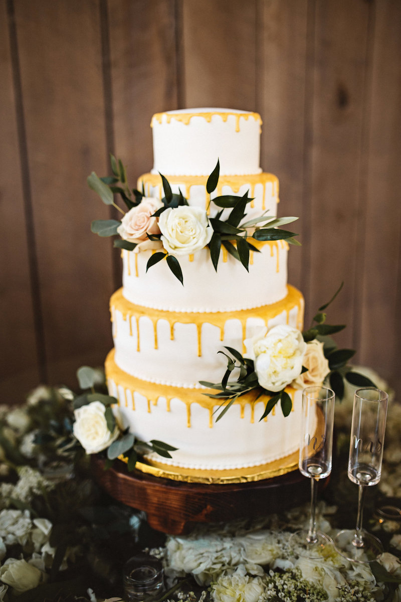 Yellow and white wedding cake at barn wedding at Spring Creek Ranch in Tennessee