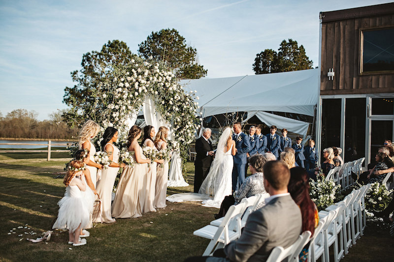 Rustic outdoor wedding ceremony at barn wedding venue Spring Creek Ranch in Tennessee