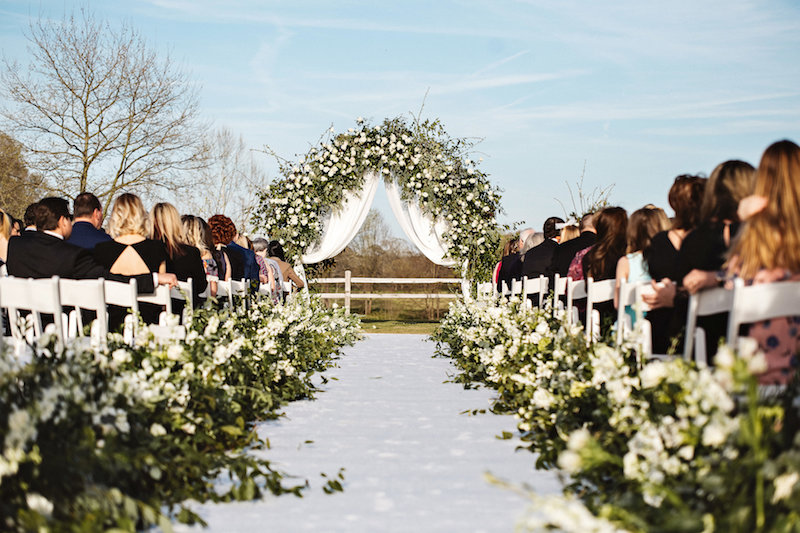 Rustic outdoor wedding ceremony at barn wedding venue Spring Creek Ranch in Tennessee