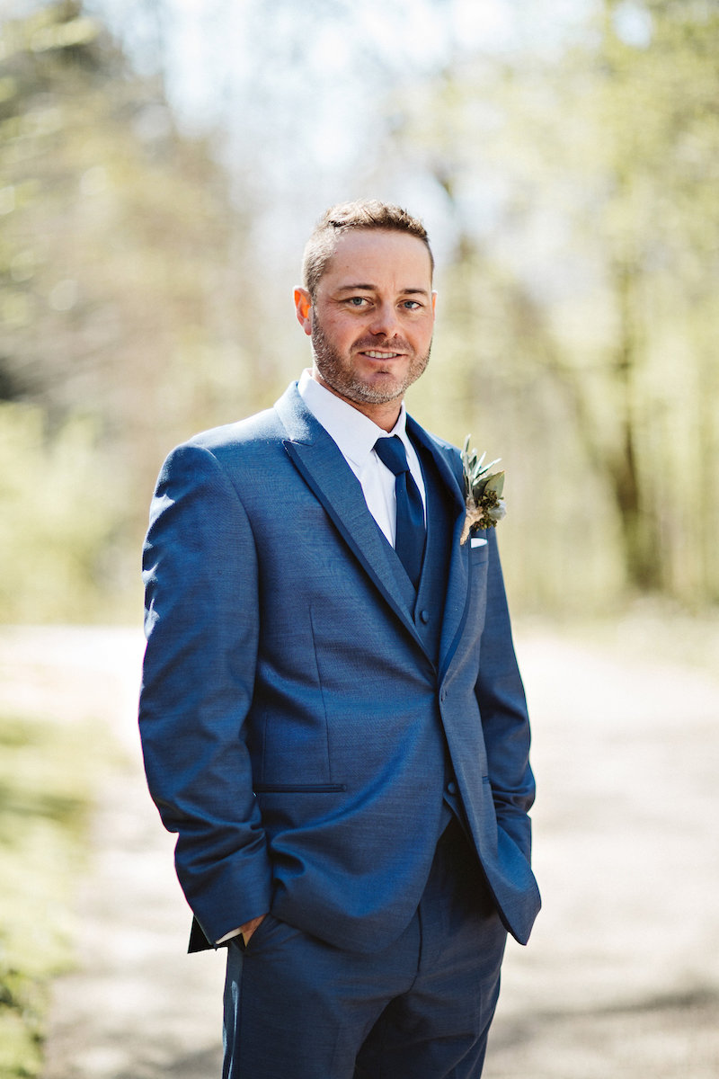 Groom at barn wedding at Spring Creek Ranch in Tennessee