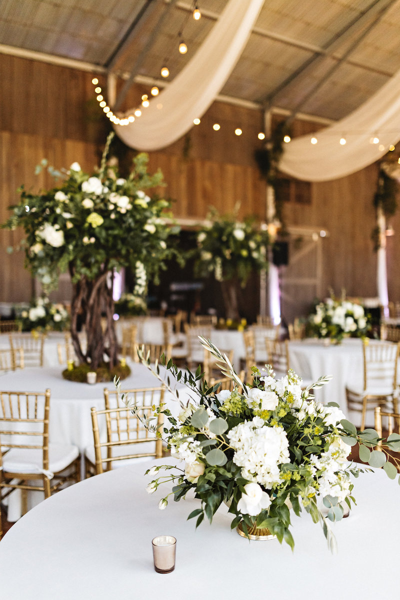 White flower centerpiece at barn wedding at Spring Creek Ranch in Tennessee