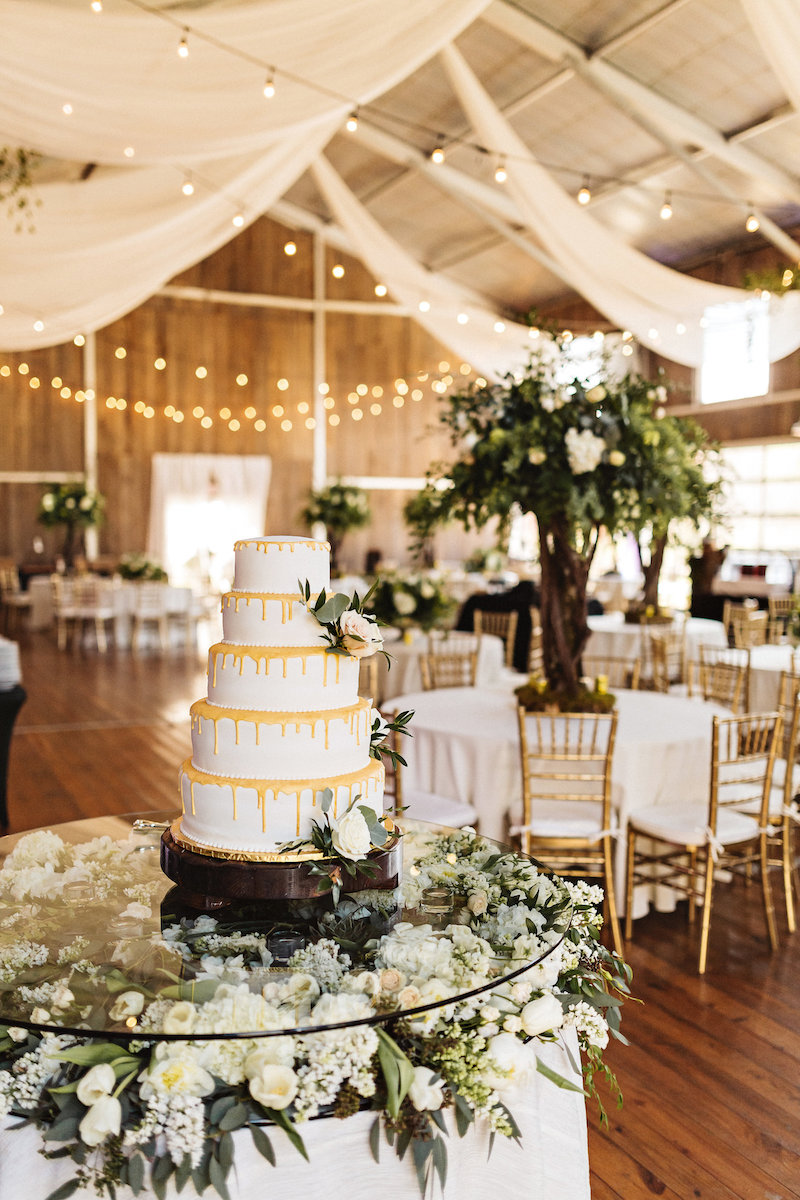 Yellow and white wedding cake at barn wedding at Spring Creek Ranch in Tennessee